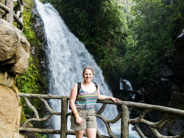 Woman standing by waterfall Costa Rica