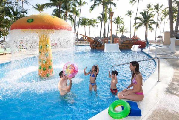 Family in hotel pool in Punta Cana